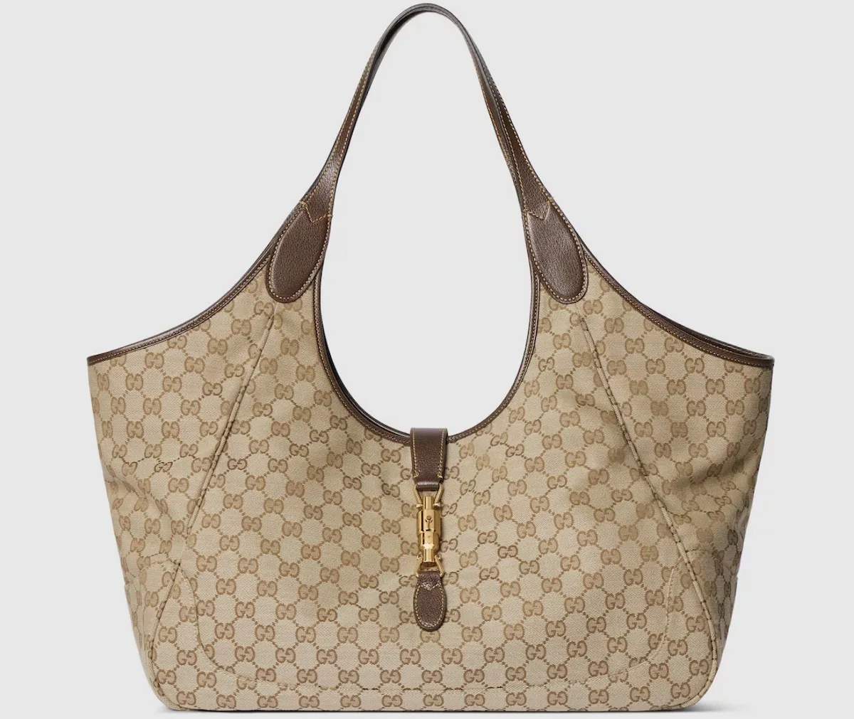 Beżowa torba Gucci Mercato z monogramem GG i brązowymi skórzanymi wykończeniami, której cena według analiz Bernstein została obniżona o około 20-25 proc.